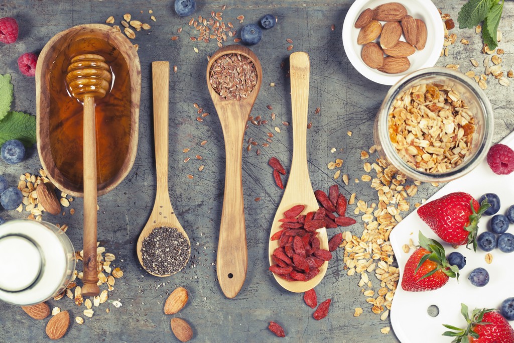Healthy Breakfast set with granola, superfoods, almond milk and